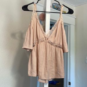 beige over shoulder shirt